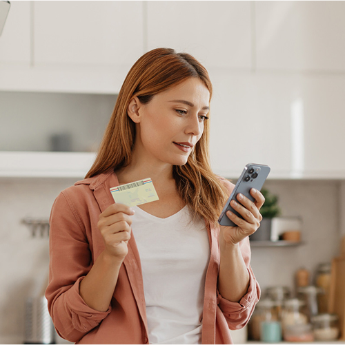 A candidate taking a photo of her ID.